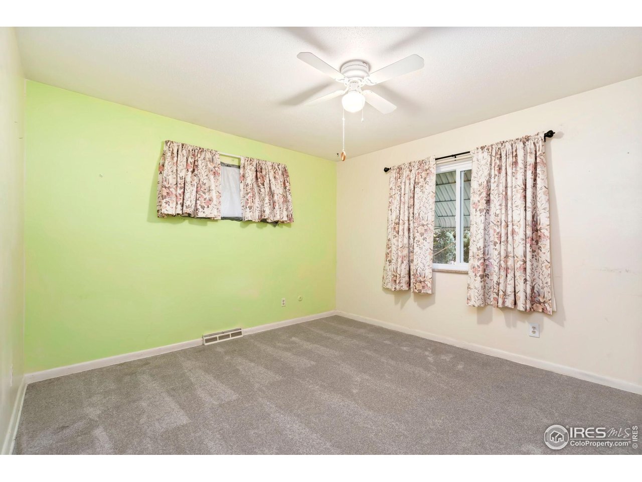 2046 26th Street Road Greeley, CO 80631 - Photo 19 of 34 a view of an empty room with a window