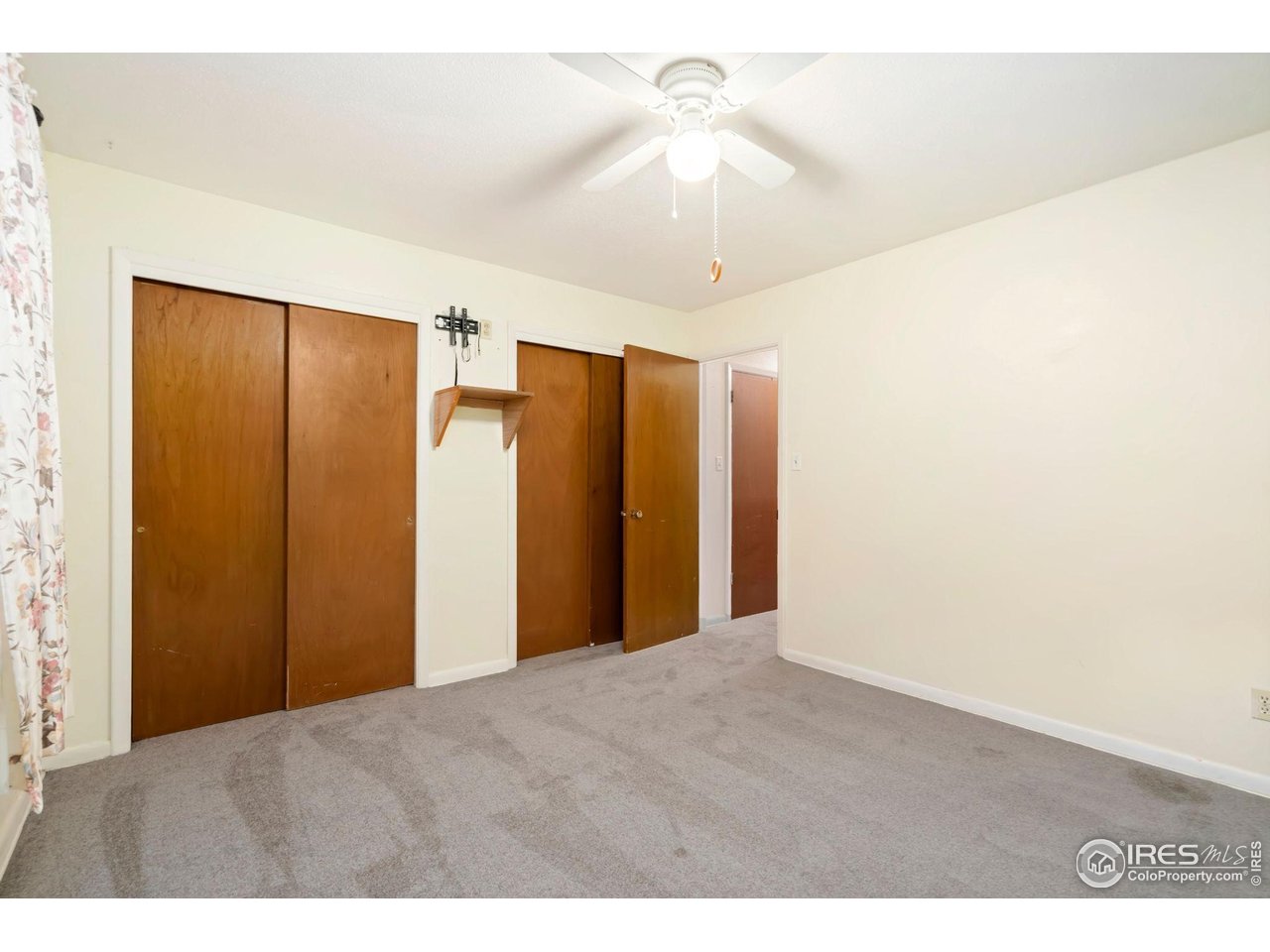 2046 26th Street Road Greeley, CO 80631 - Photo 20 of 34 a view of an empty room with a ceiling fan