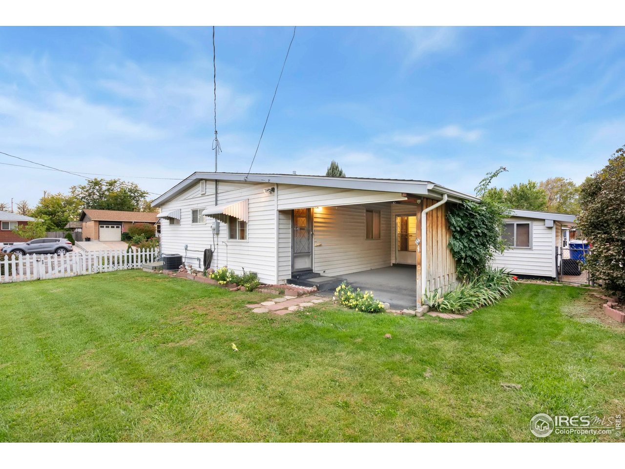 2046 26th Street Road Greeley, CO 80631 - Photo 27 of 34 a backyard of a house with table and chairs