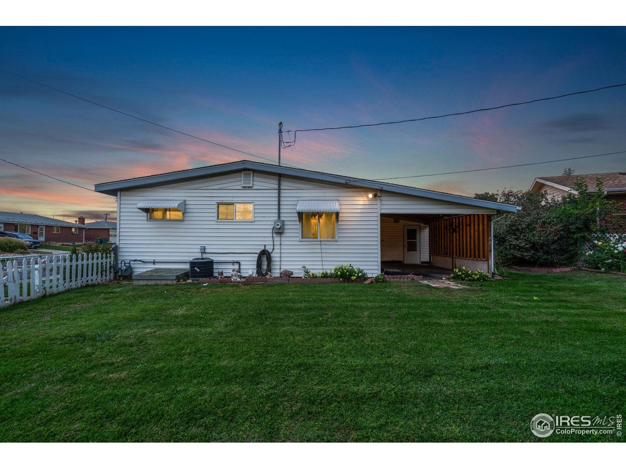 2046 26th Street Road Greeley, CO 80631 - Photo 31 of 34 a front view of house with yard and green space