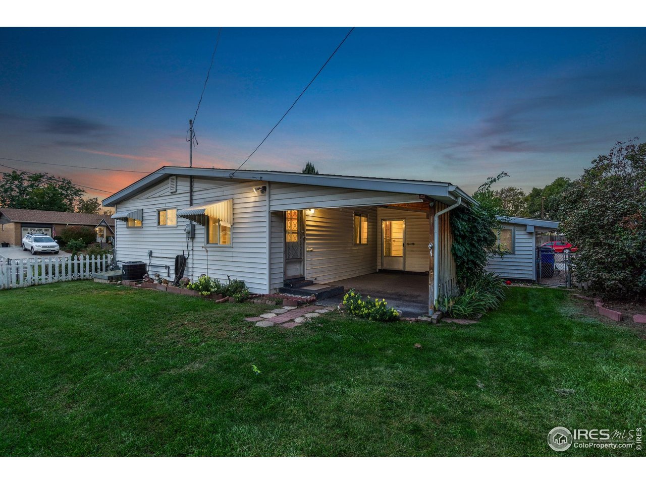 2046 26th Street Road Greeley, CO 80631 - Photo 33 of 34 a front view of a house with a yard