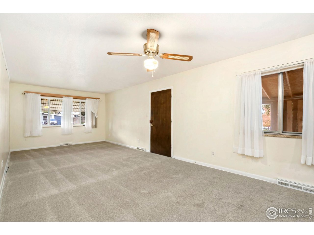2046 26th Street Road Greeley, CO 80631 - Photo 8 of 34 a view of an empty room with a window