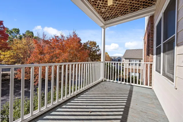 a view of a balcony with wooden floor