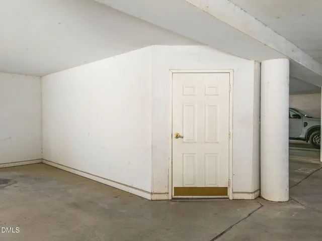 an empty room with closet area