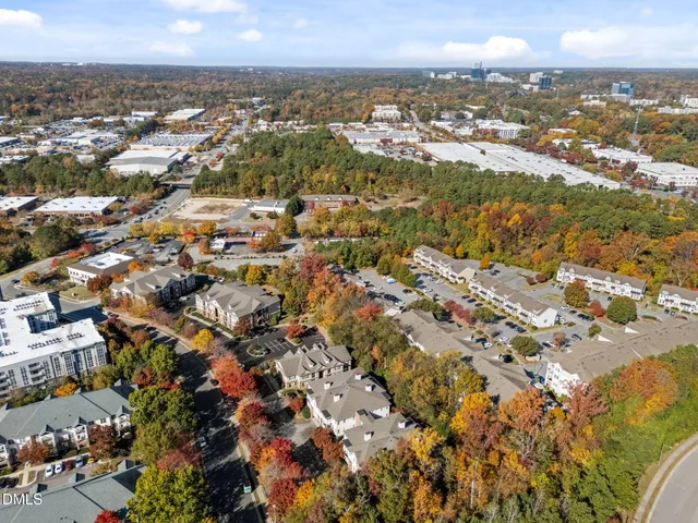 an aerial view of residential building and ocean