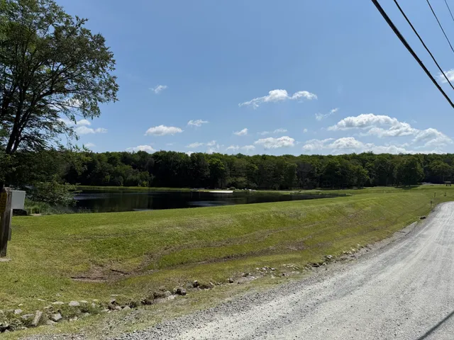 a view of a lake in middle of the town