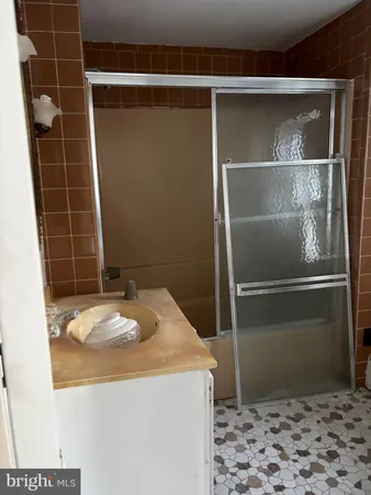 a bathroom with a granite countertop sink