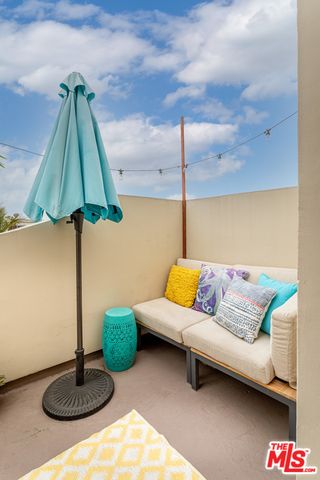 a living room with furniture and a lamp