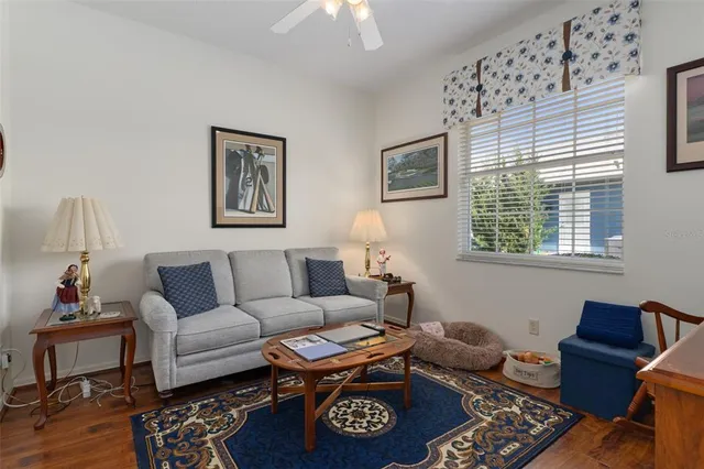 a living room with furniture and a window