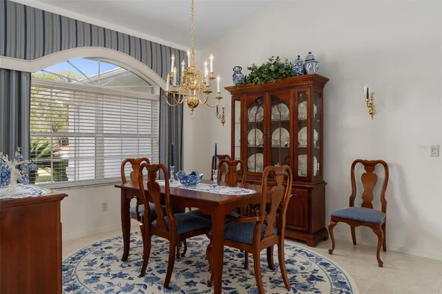a view of a dining room with furniture and window
