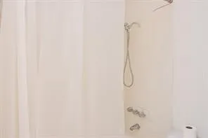 a bathroom with a glass shower door