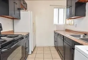 a kitchen with a stove and a sink