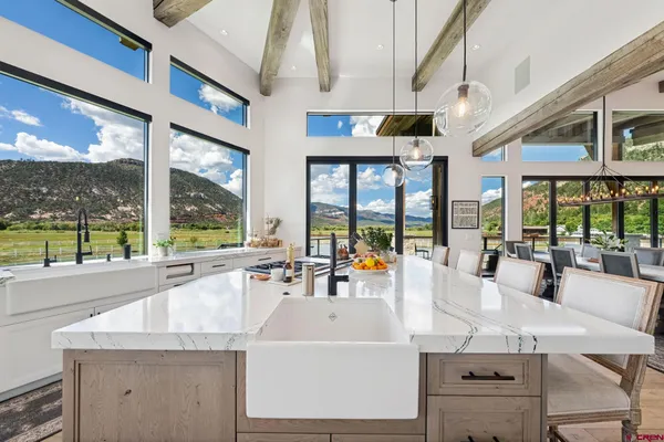 a kitchen with stainless steel appliances granite countertop a sink and cabinets