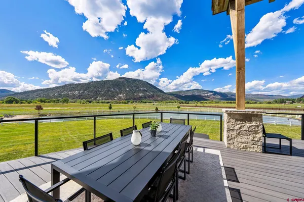 a view of a chairs and table on the terrace