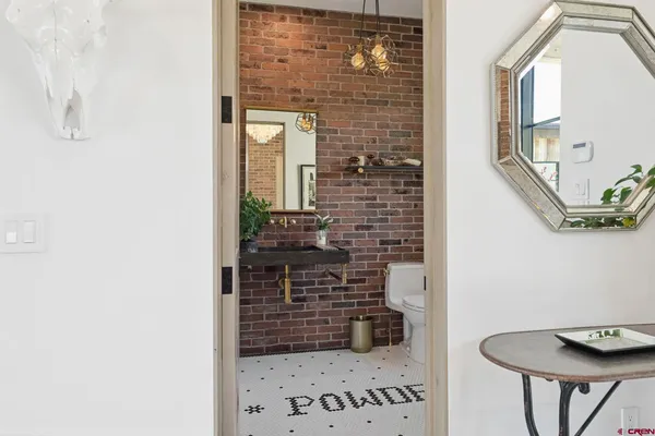 a bathroom with a shower and a sink