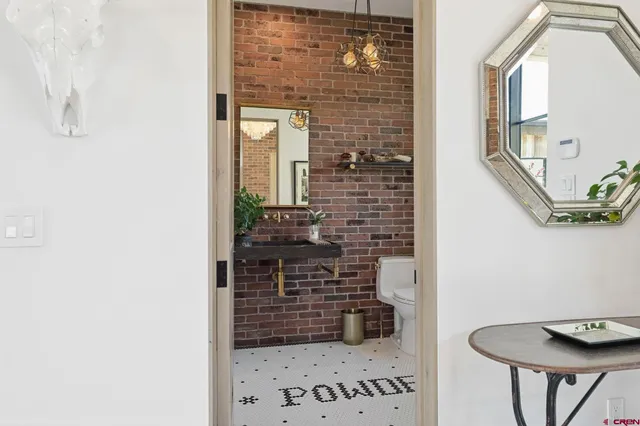 a bathroom with a shower and a sink