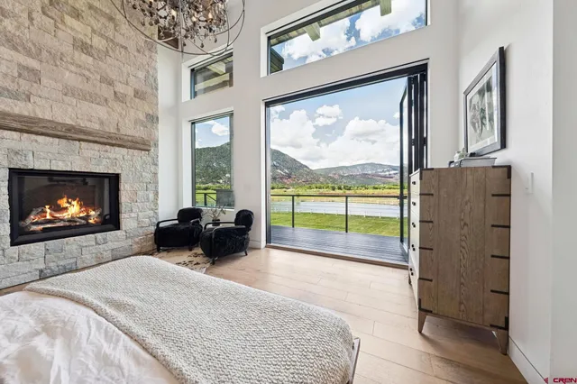 a bed room with a bed and a fireplace