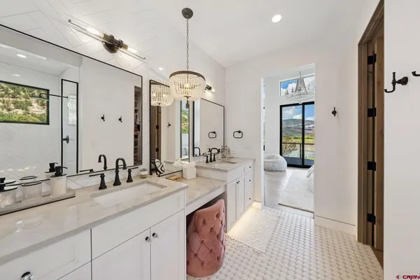 a spacious bathroom with sinks mirror and a shower