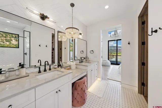 a spacious bathroom with sinks mirror and a shower