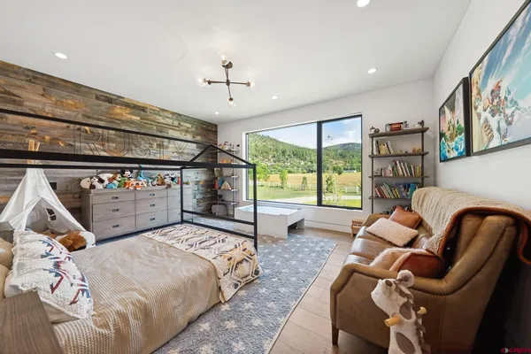 a bed room with furniture and a window