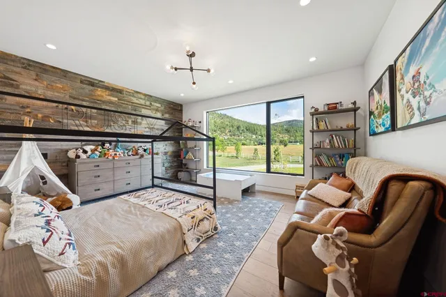 a bed room with furniture and a window