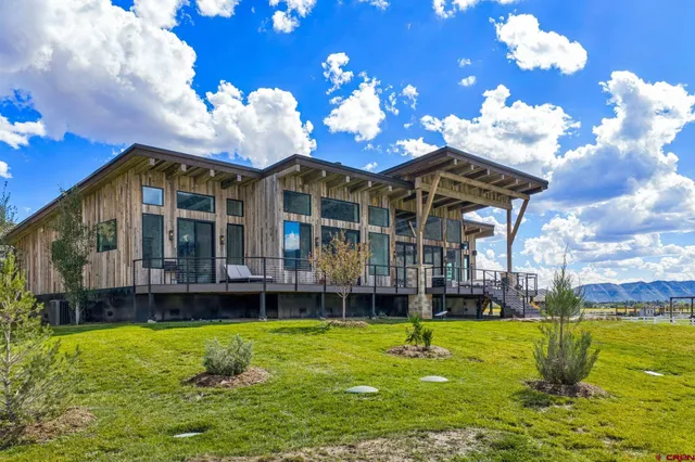 a view of a house with a backyard