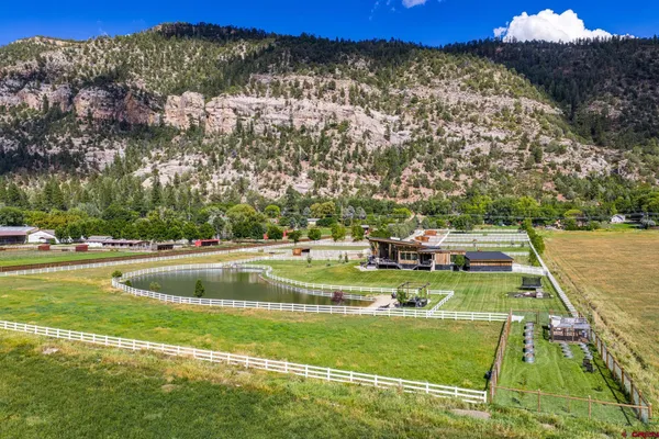 a view of a swimming pool with a yard