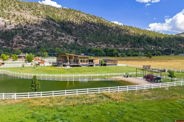 a view of a swimming pool with a yard
