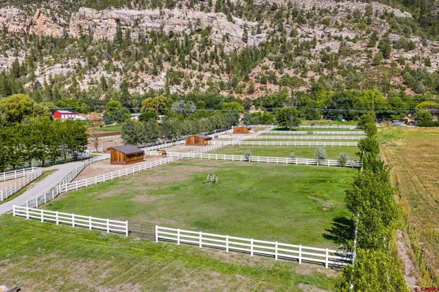 a view of a pool with a yard
