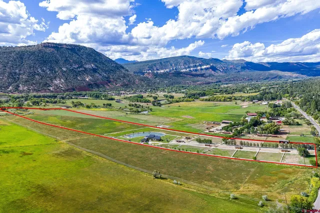 a view of a swimming pool with a yard