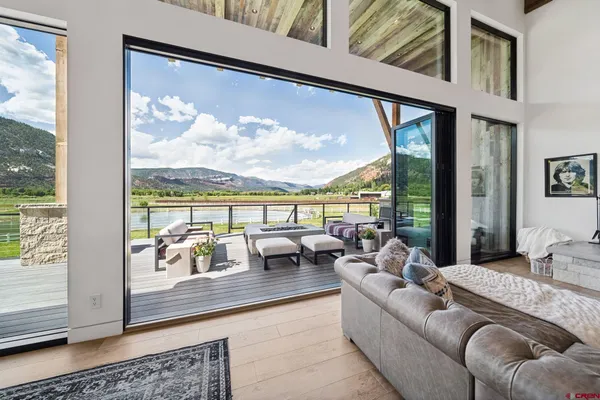 a living room with furniture and a large window