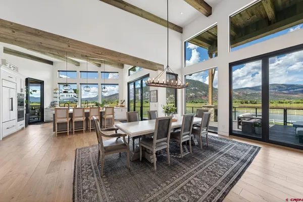 a view of a dining room with furniture window and wooden floor