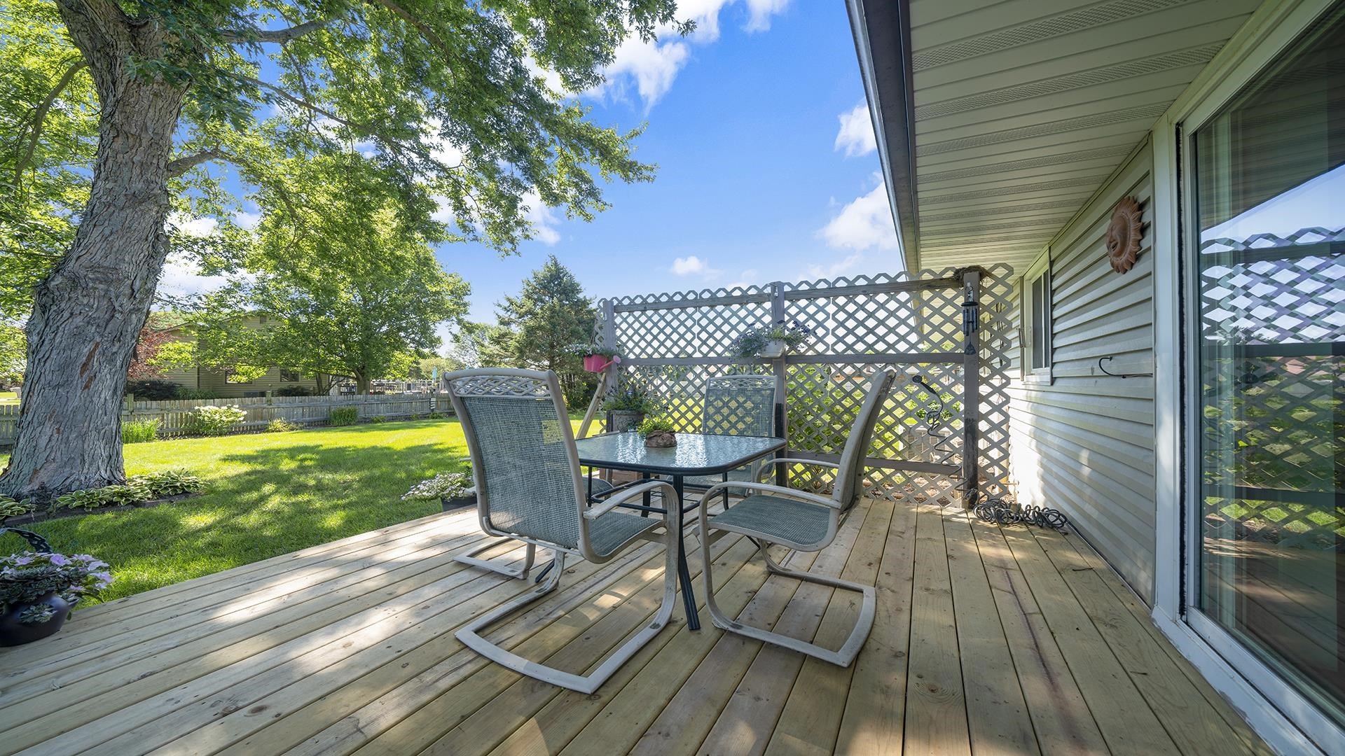 3920 Cutty Sark Road Cherry Valley, IL 61016 - Photo 28 of 30 a view of a chairs and table on the wooden deck
