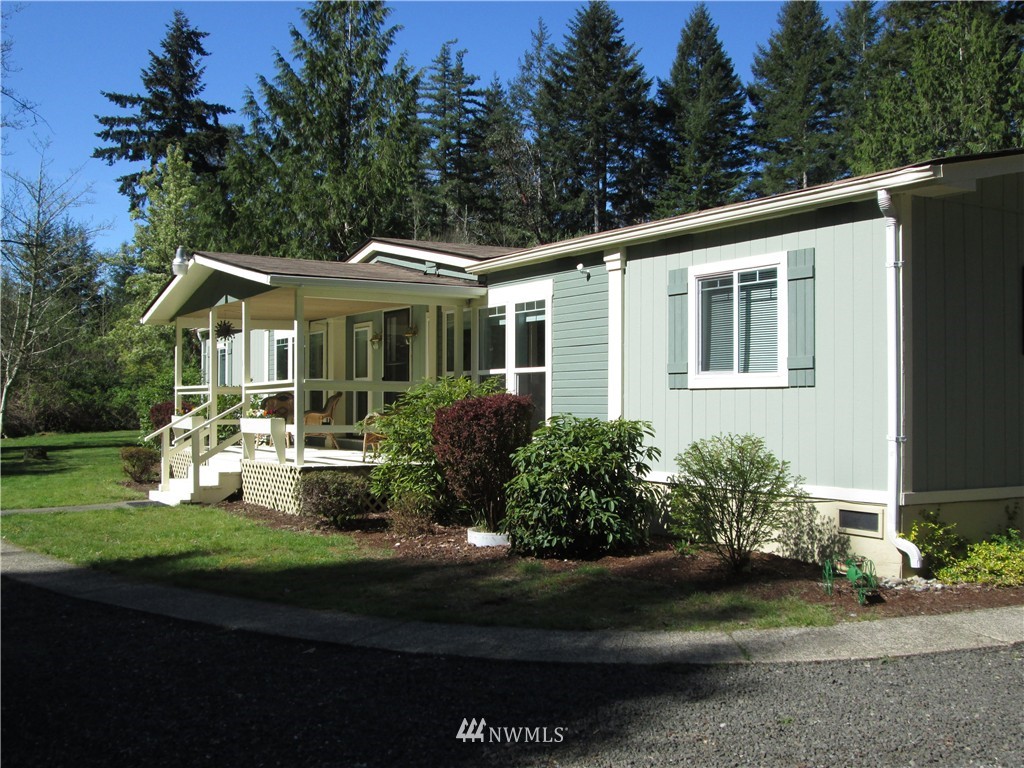 18905 Rouse Road Southwest Longbranch, WA 98351 - Photo 2 of 25 a front view of a house with garden