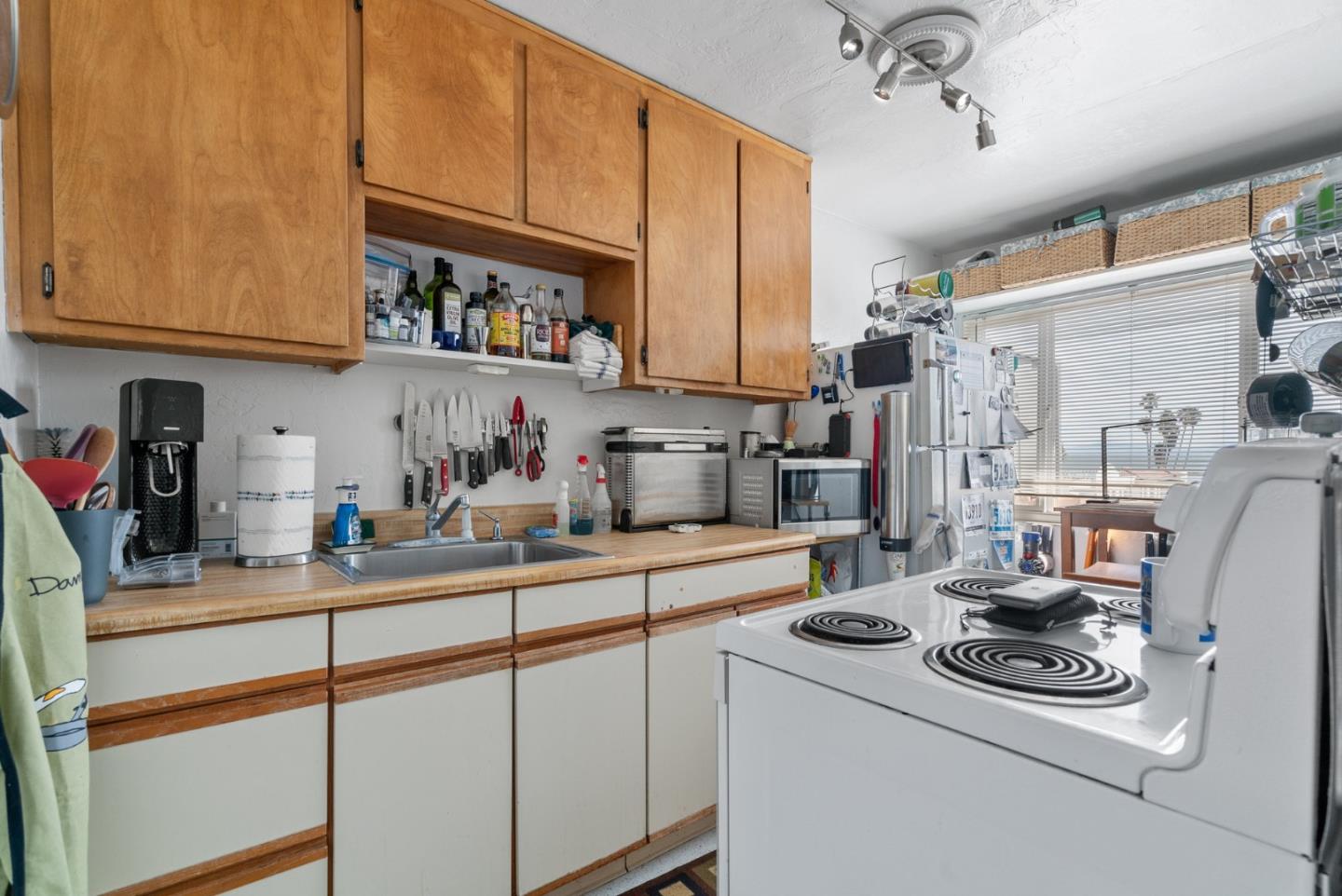 321 Second Street Santa Cruz, CA 95060 - Photo 22 of 34 a kitchen with stainless steel appliances granite countertop a sink a stove and a refrigerator