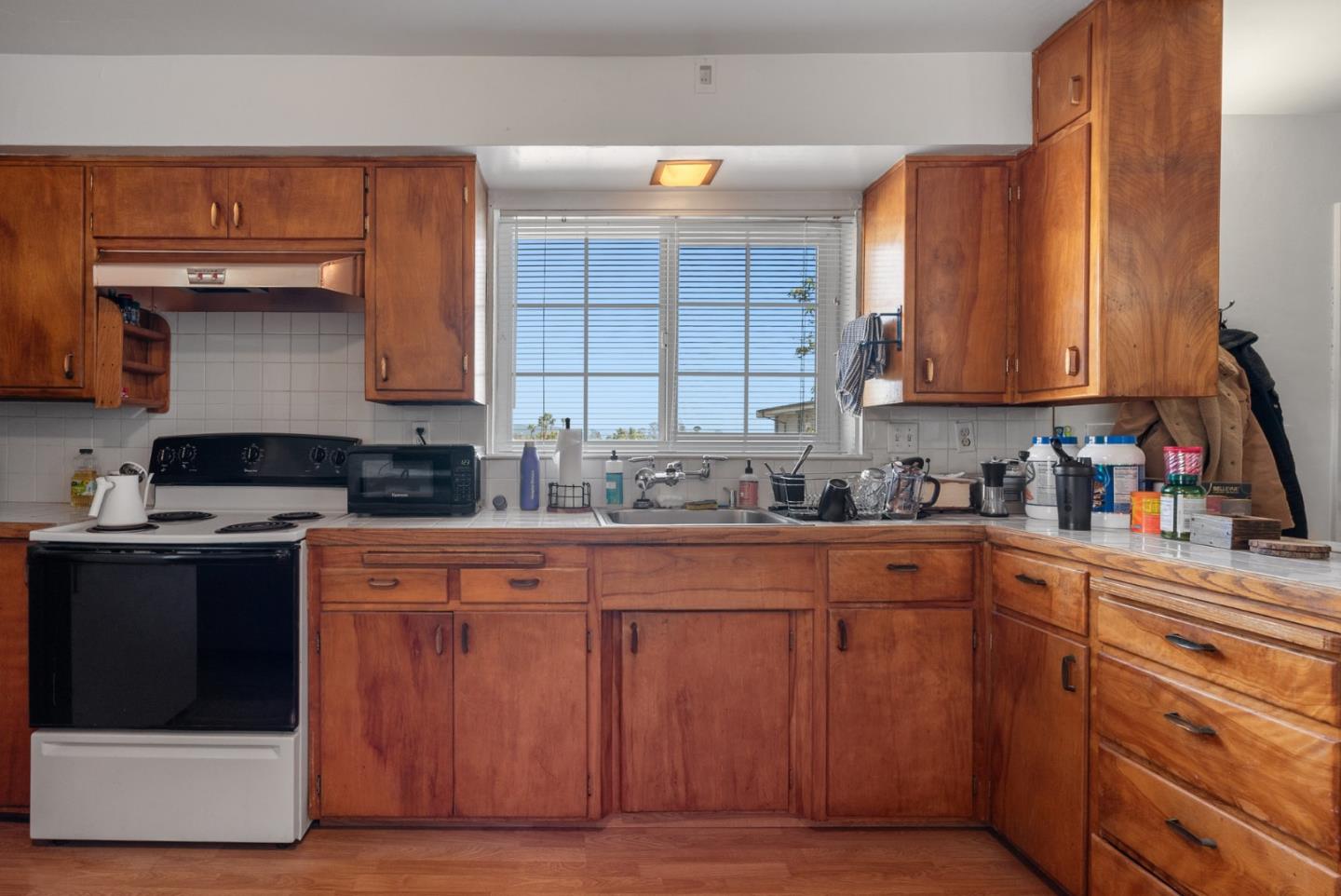 321 Second Street Santa Cruz, CA 95060 - Photo 28 of 34 a kitchen with stainless steel appliances granite countertop a stove a sink and a microwave