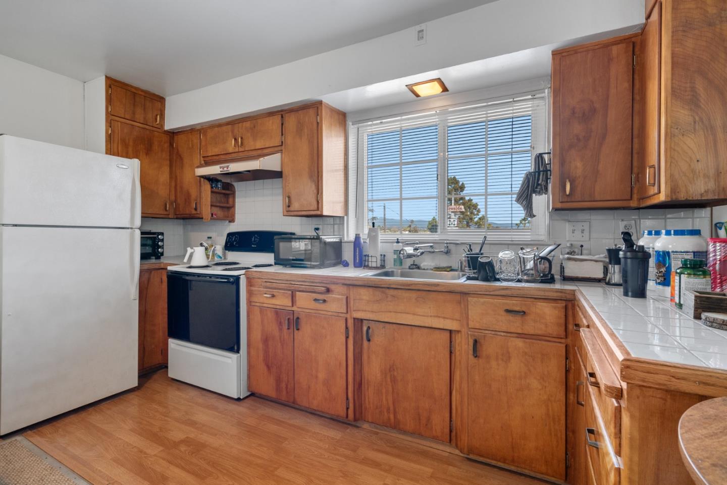 321 Second Street Santa Cruz, CA 95060 - Photo 30 of 34 a kitchen with stainless steel appliances granite countertop a refrigerator sink and cabinets