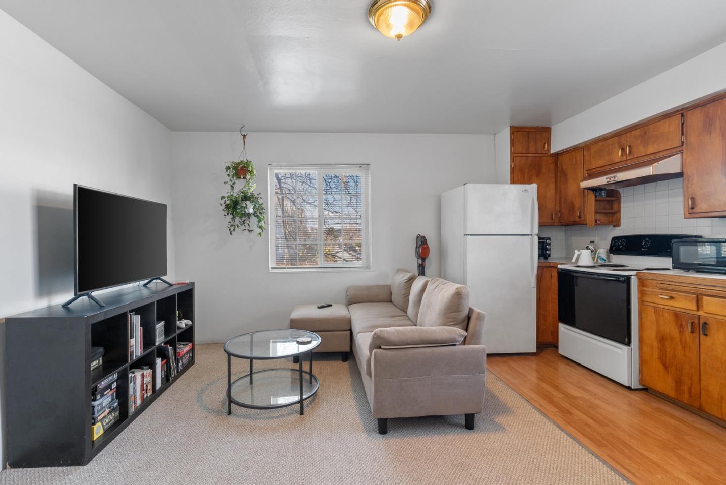 321 Second Street Santa Cruz, CA 95060 - Photo 31 of 34 a living room with furniture and a flat screen tv