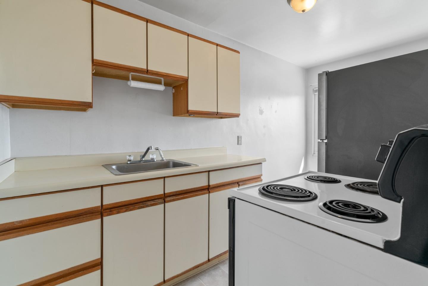 321 Second Street Santa Cruz, CA 95060 - Photo 33 of 34 a kitchen with stainless steel appliances a stove a sink and a refrigerator