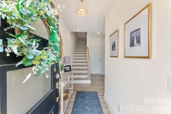 a view of entryway with wooden floor