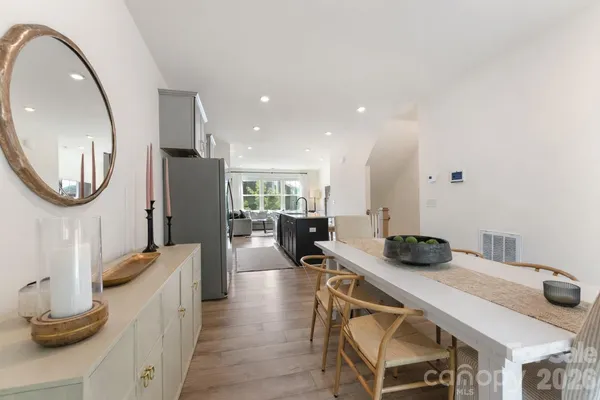 a kitchen with a table and chairs