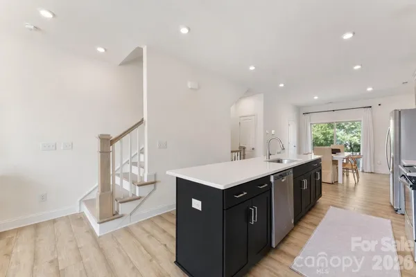 a kitchen with a sink and cabinets