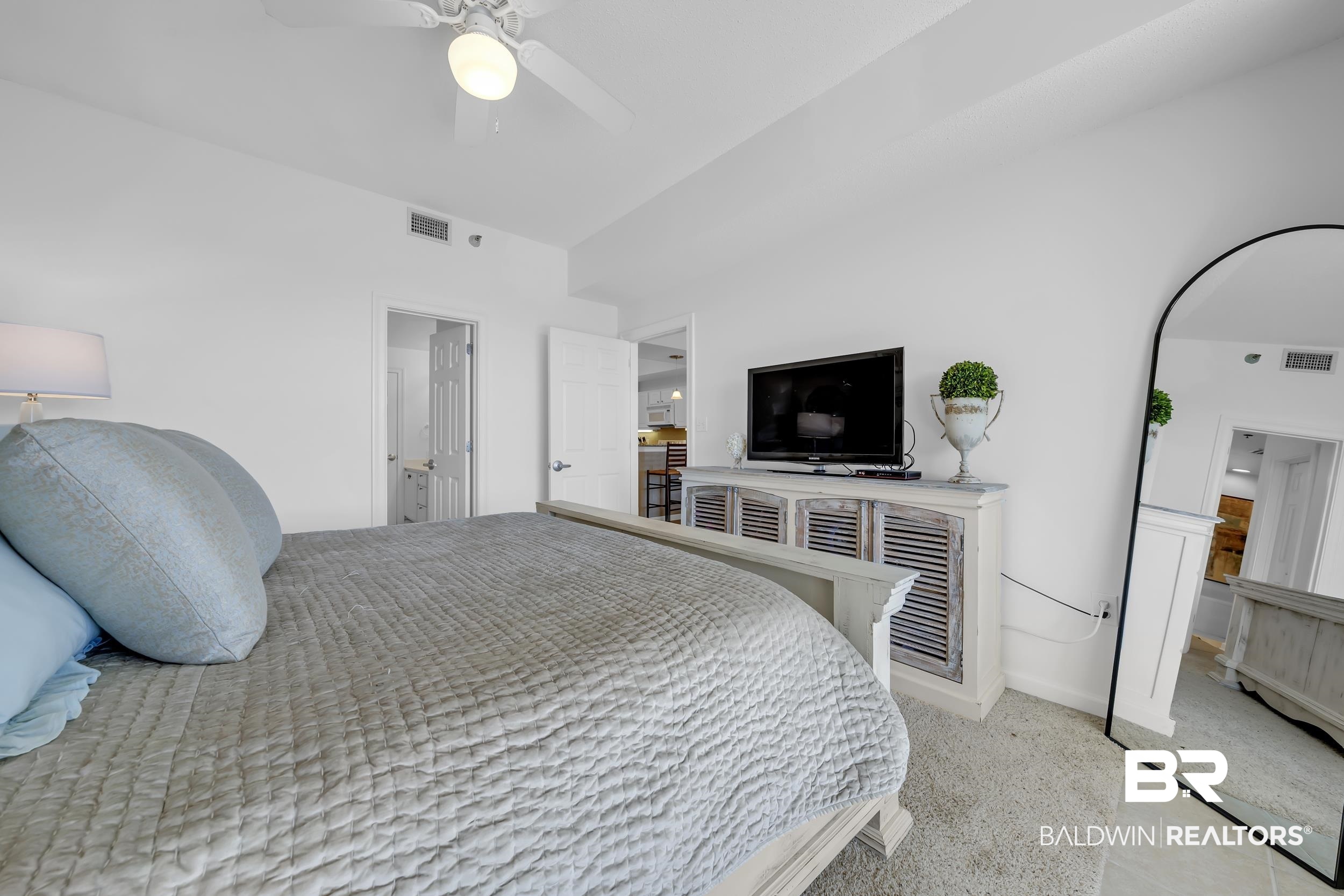 27282 Canal Road, Unit 104 Orange Beach, AL 36561 - Photo 32 of 79 Bedroom with light carpet and ceiling fan