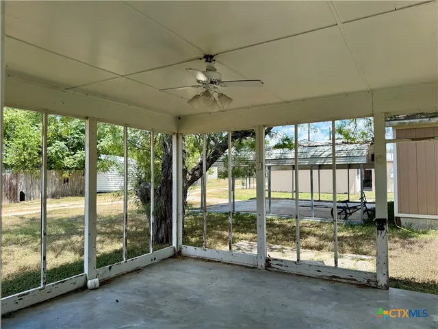 a view of a room with balcony and ocean view