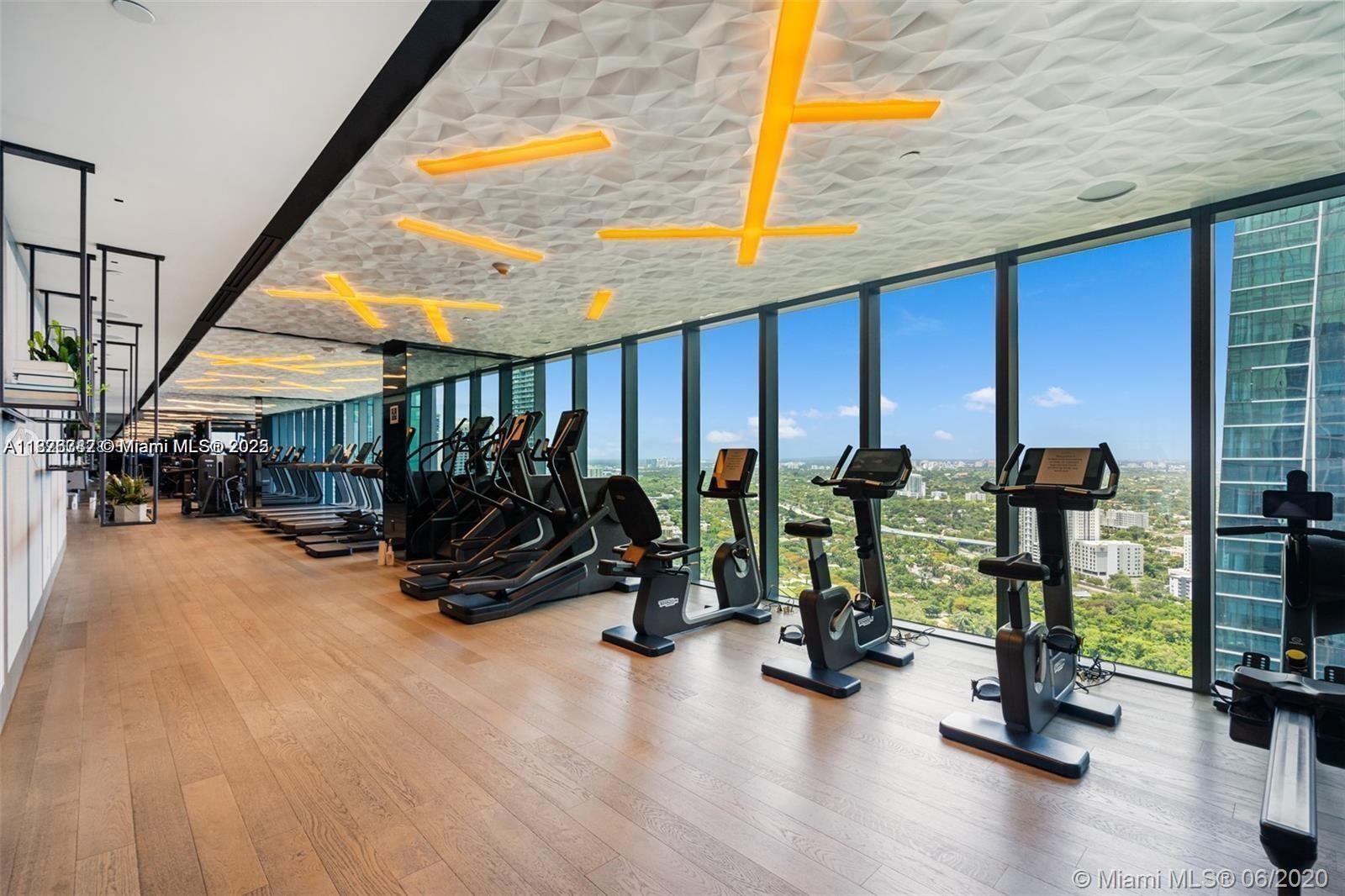 1451 Brickell Avenue, Unit 3102 Miami, FL 33131 - Photo 14 of 25 a view of a room with gym equipment