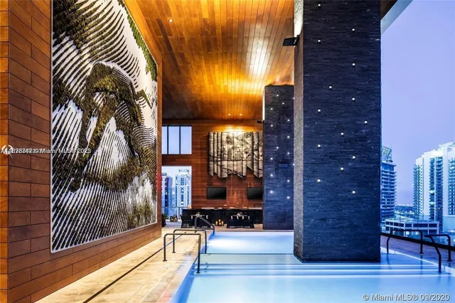 a view of lobby with a floor to ceiling window and wooden floor