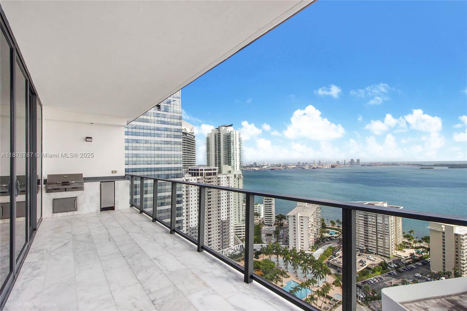 1451 Brickell Avenue, Unit 3102 Miami, FL 33131 - Photo 2 of 25 a view of balcony with furniture