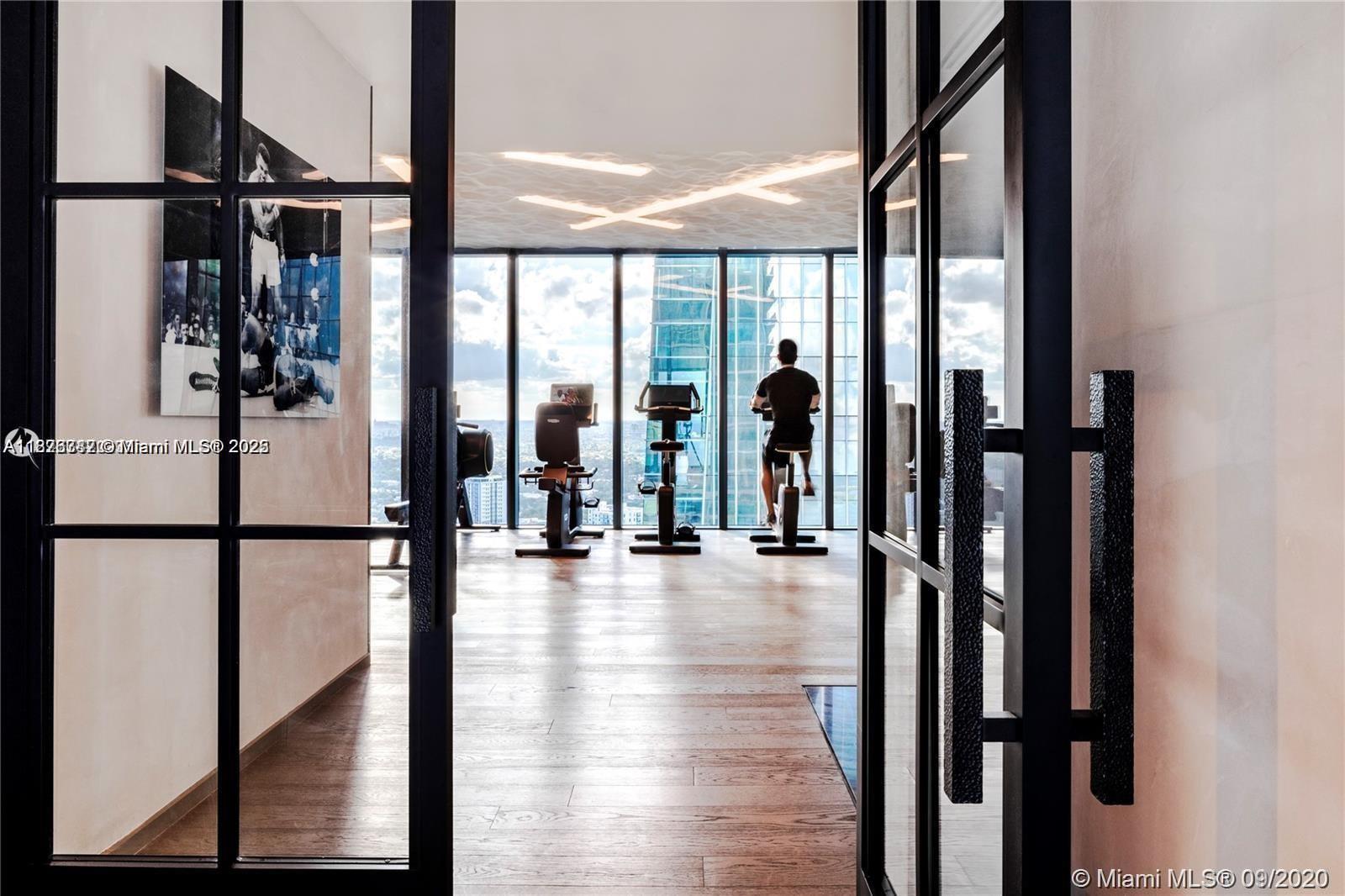 1451 Brickell Avenue, Unit 3102 Miami, FL 33131 - Photo 21 of 25 a view of lobby with a floor to ceiling window and wooden floor