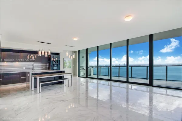 a dining space with furniture and window