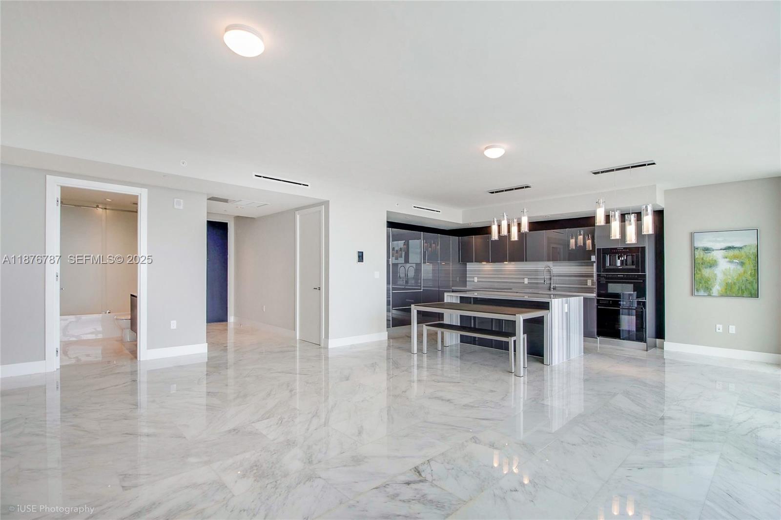 1451 Brickell Avenue, Unit 3102 Miami, FL 33131 - Photo 6 of 12 a dining space with furniture and window